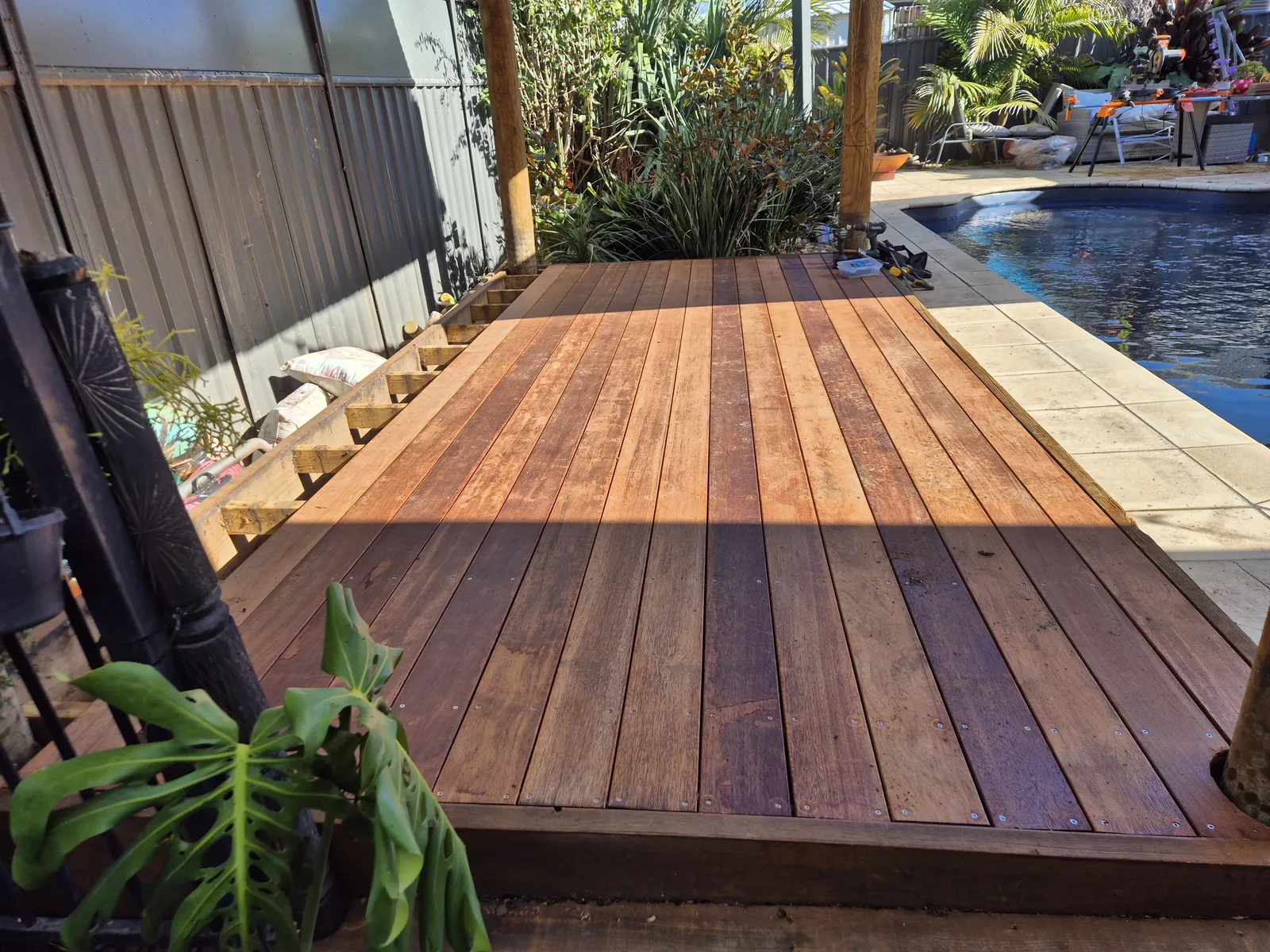 Finished hardwood poolside deck