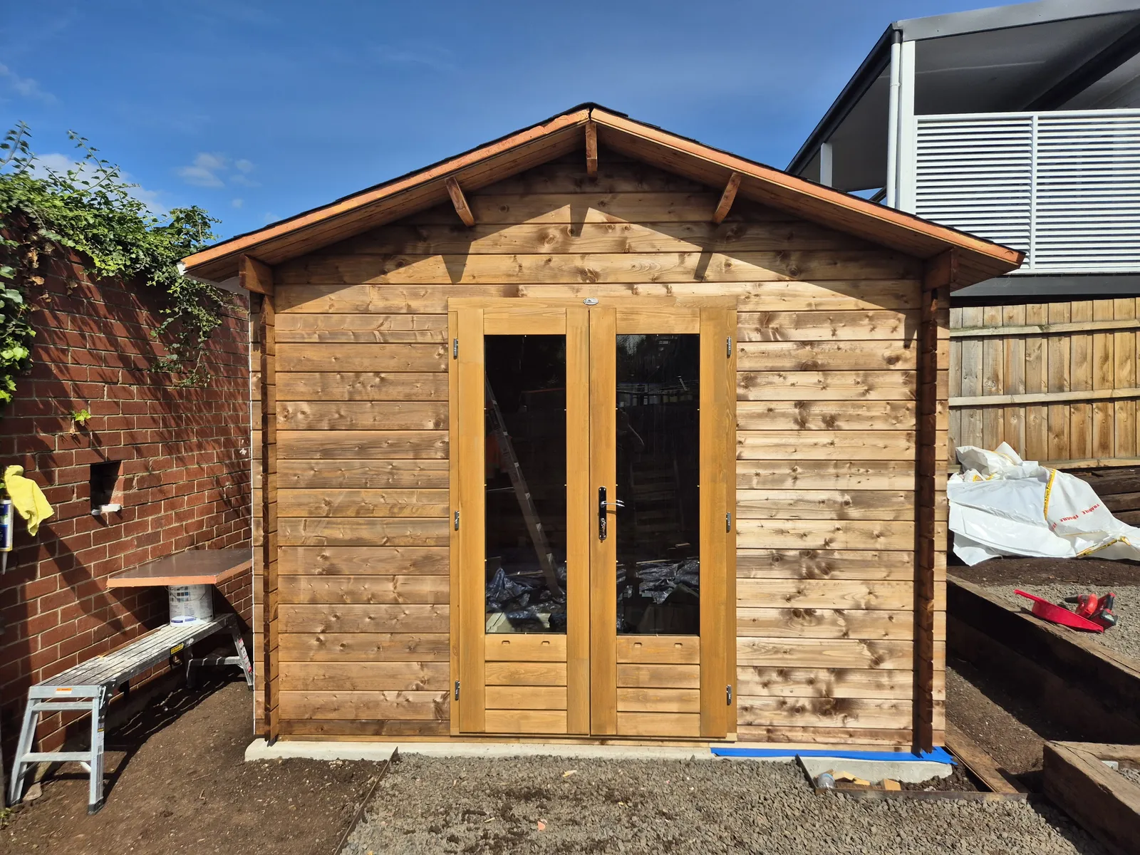 Custom French double doors fitted to the front of the cabin